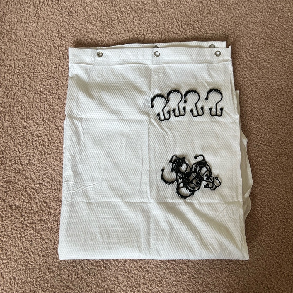 White shower curtain with hooks